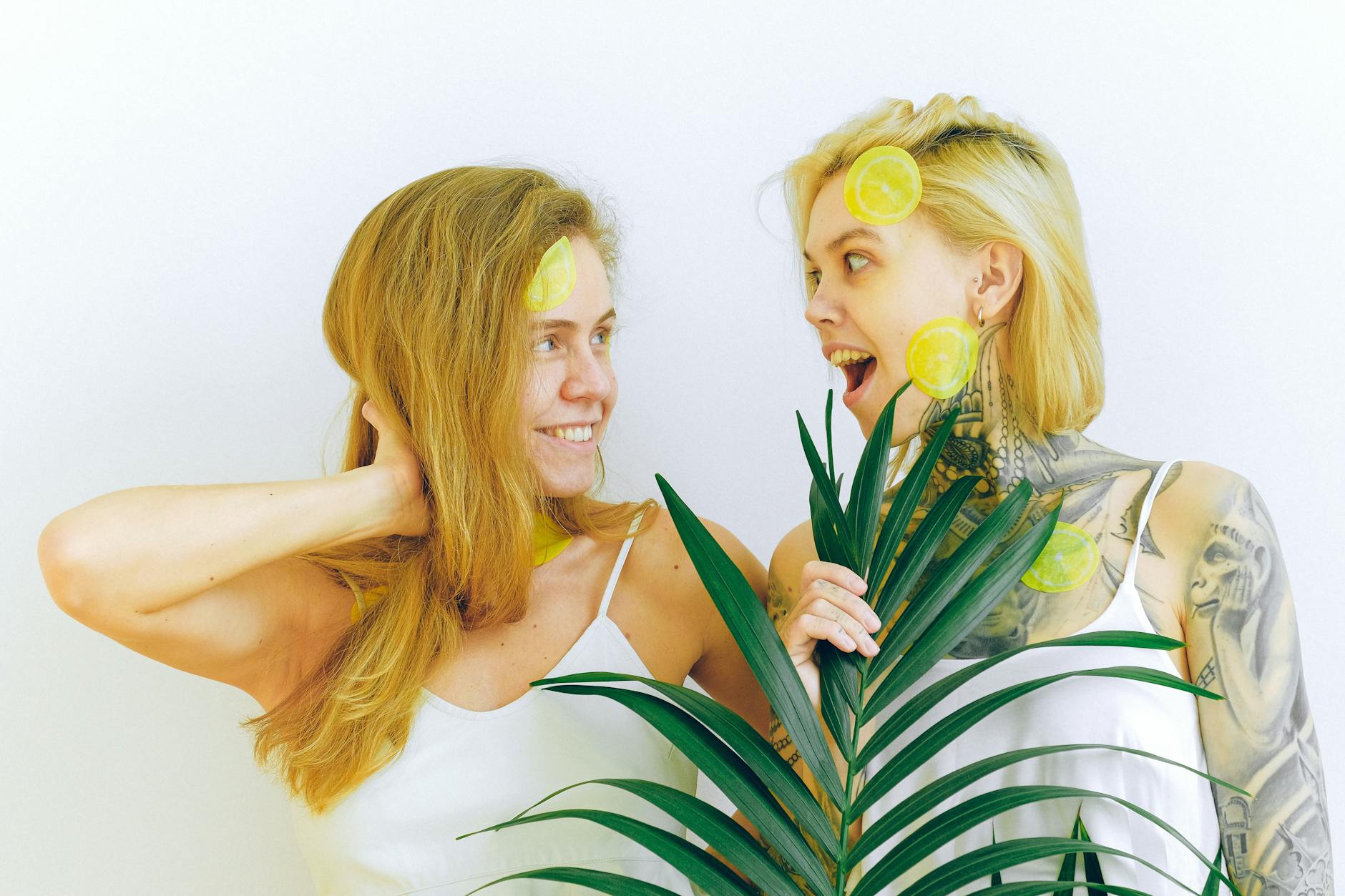Two people laughing together, expressing genuine comfort and joy during an intimate conversation