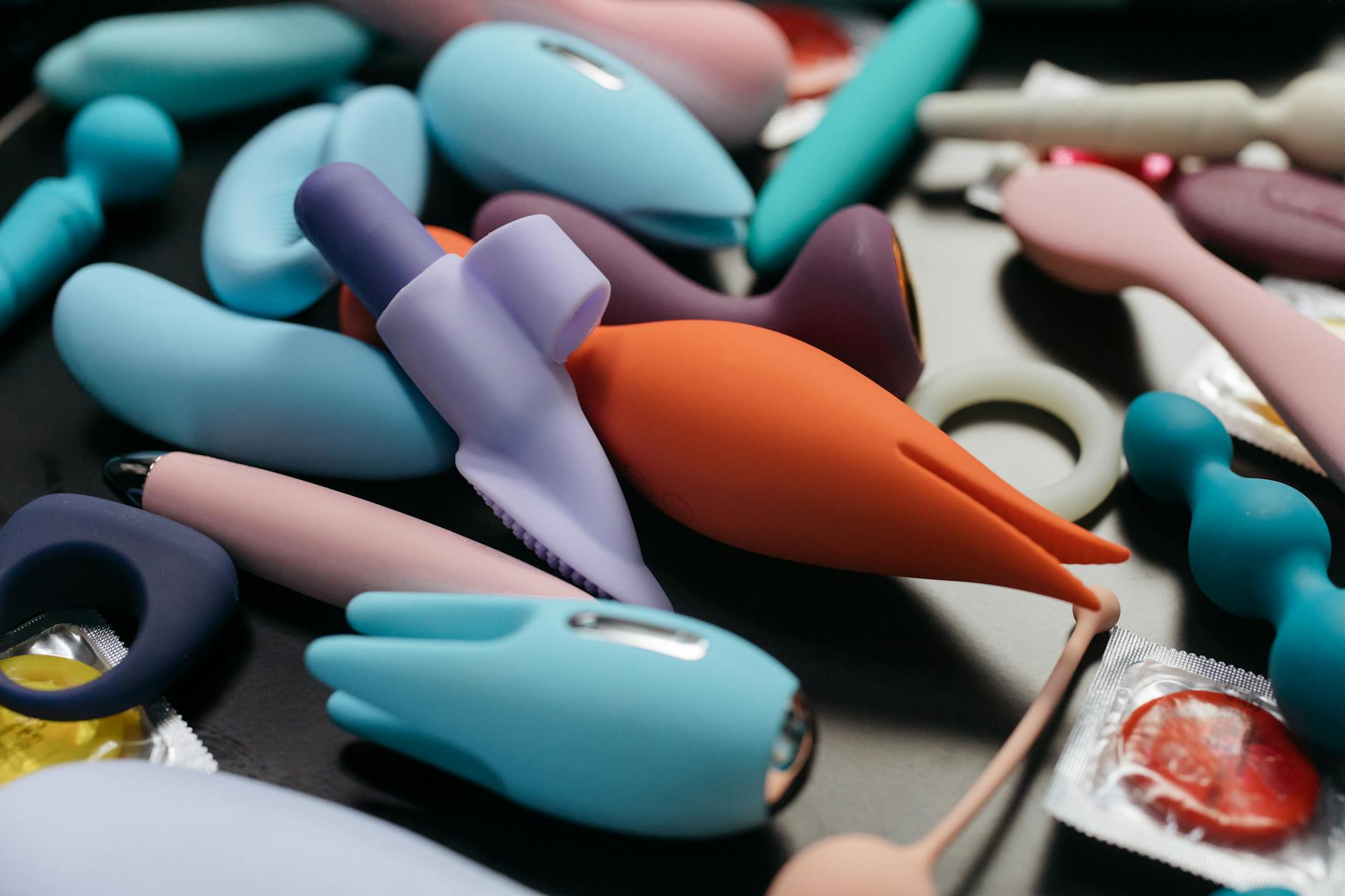 Close-up of colorful silicone adult toys arranged together